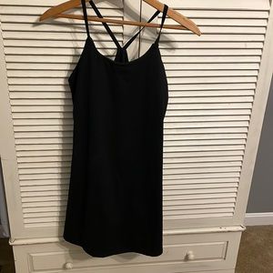 Athletic dress never worn. Built in bra and shorts with pockets.